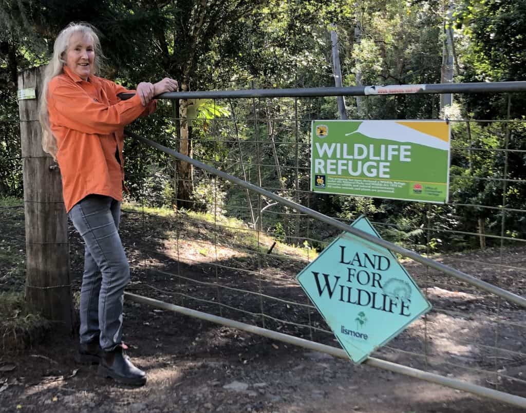 Environmental project officer Julie Reid at the gate of her property